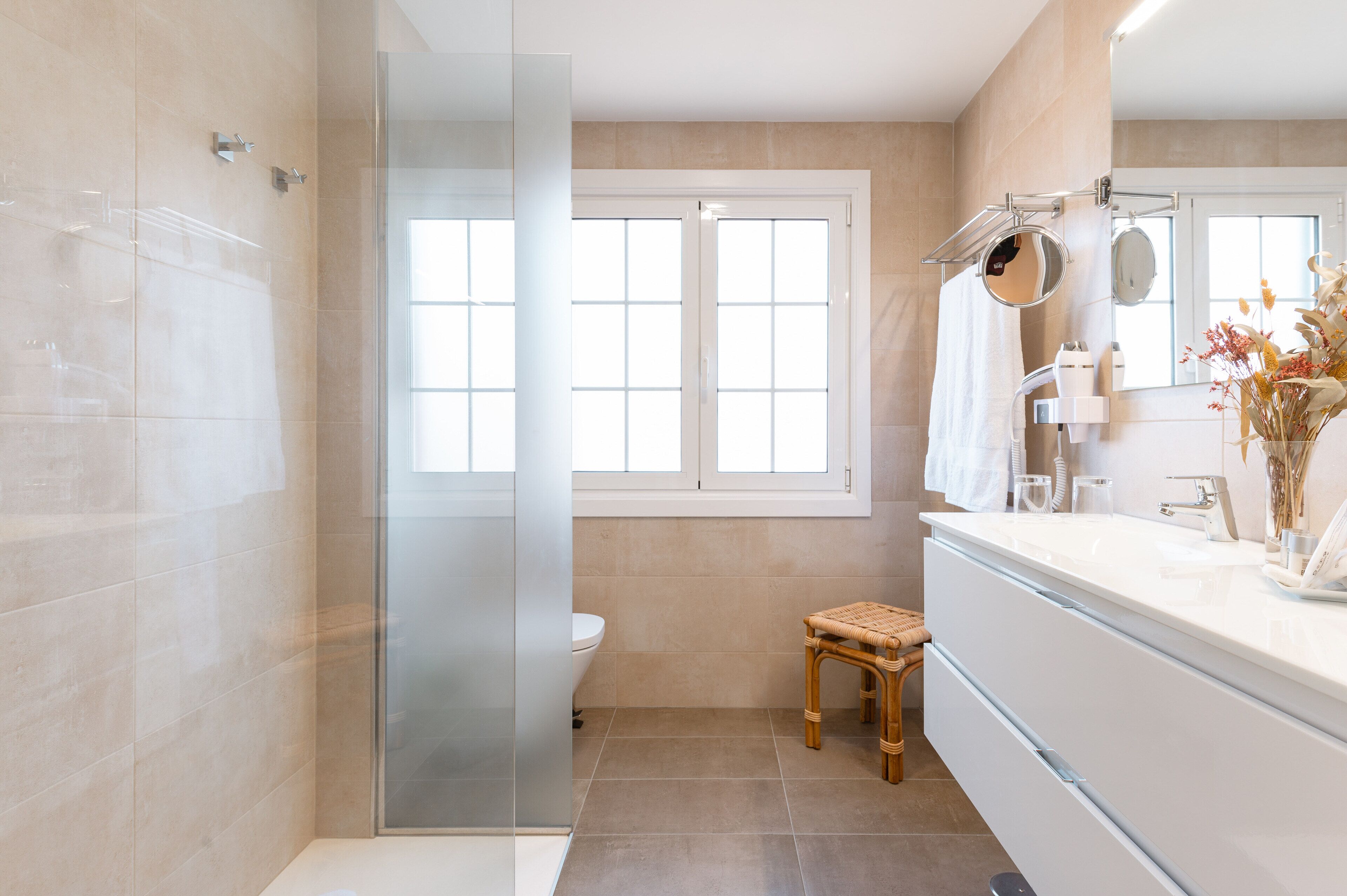 deluxe room | bathroom | shower, hair dryer, bathrobes, towels