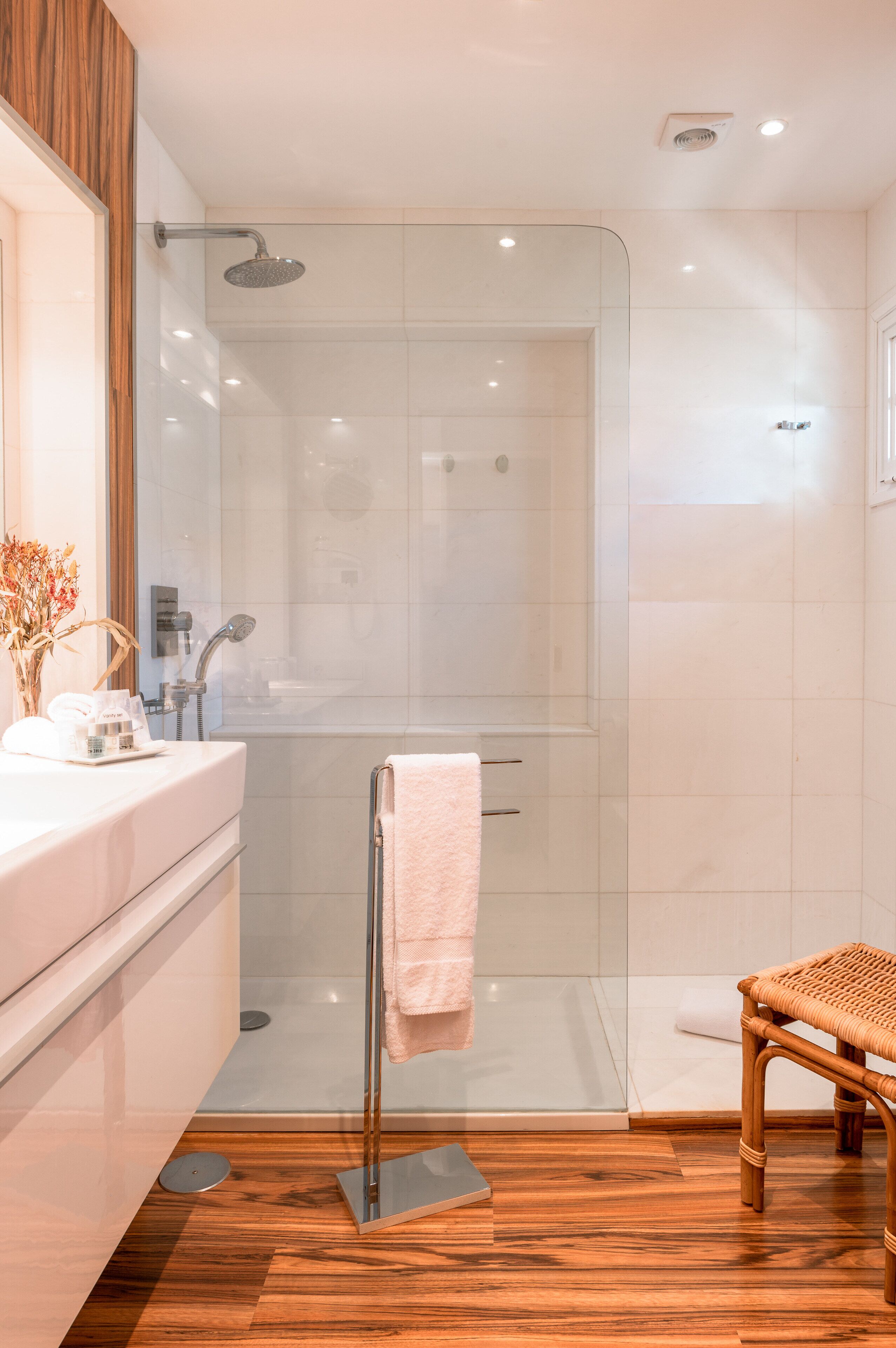 deluxe suite | bathroom | shower, hair dryer, bathrobes, towels