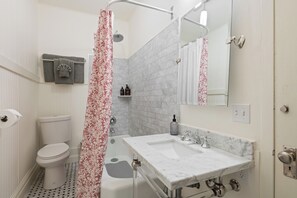 Combined shower/tub, hair dryer, towels, soap