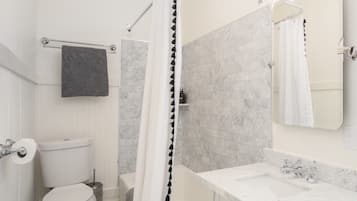 Combined shower/tub, hair dryer, towels, soap