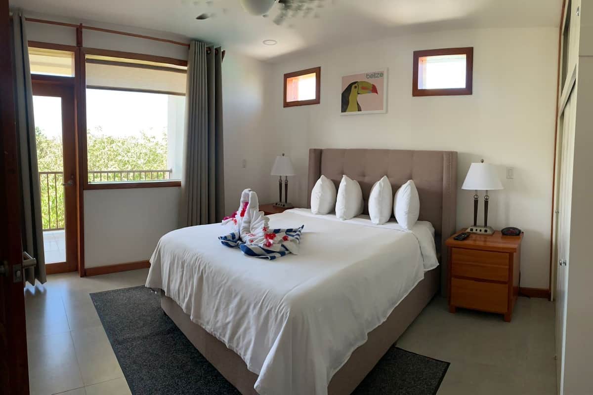 Desk, laptop workspace, iron/ironing board, bed sheets