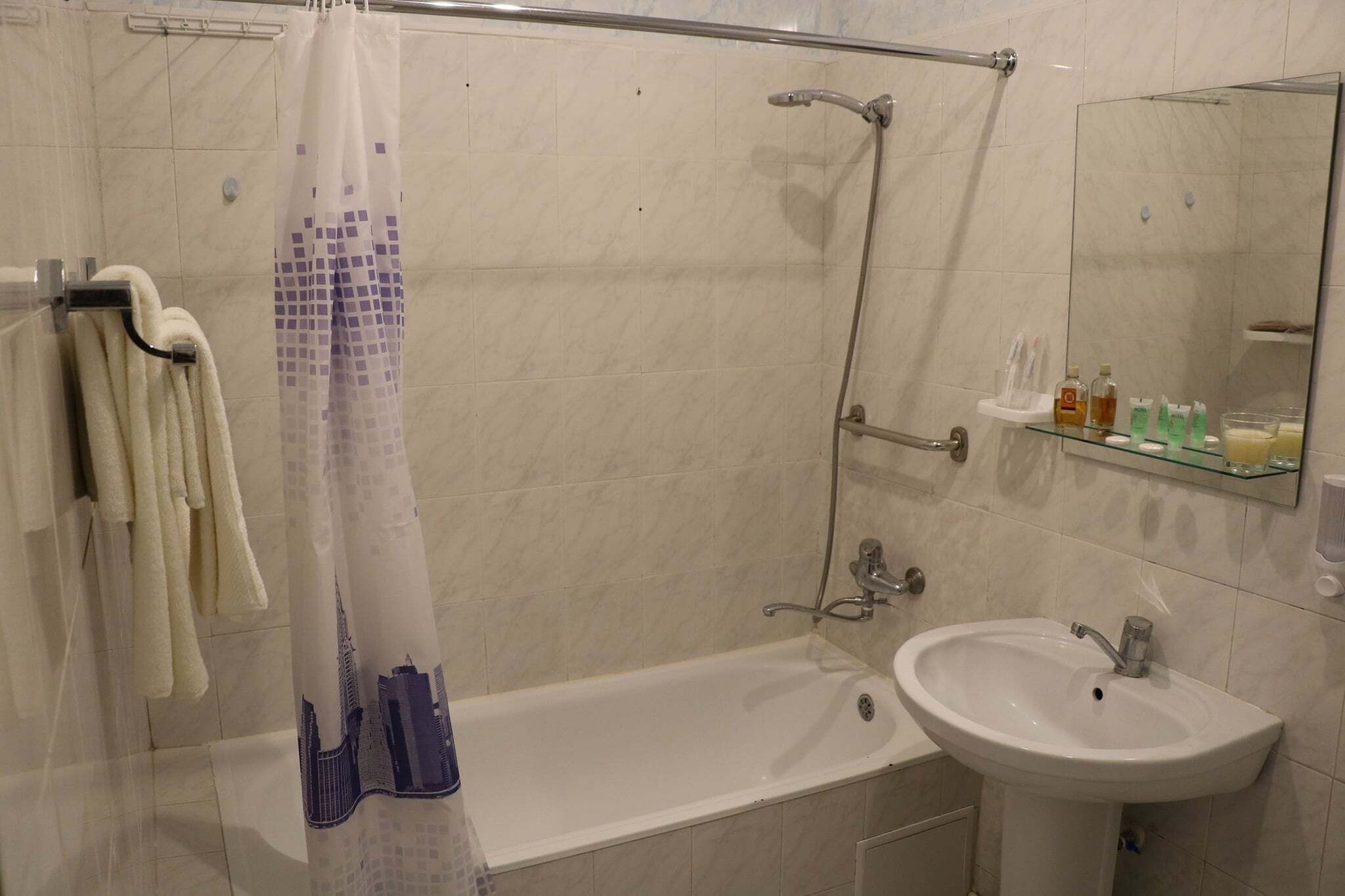 Combined shower/tub, free toiletries, hair dryer, slippers