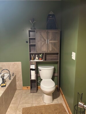 Bathtub, jetted bath, hair dryer, towels