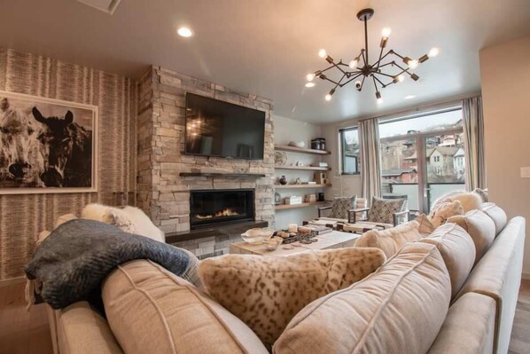 Townhome | Living area | 40-inch flat-screen TV with cable channels, TV, fireplace - Main Street Townhome by Park City Vacations (Park City)