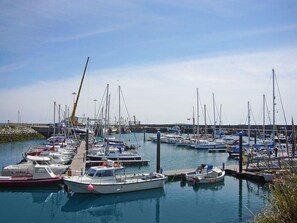 A marina with various boats docked, including sailboats and motorboats. - Saltee View Holiday Home (Kilmore)