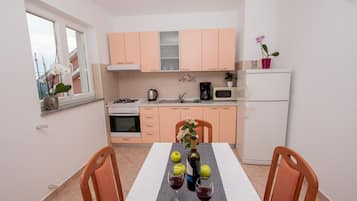 Fridge, oven, electric kettle, cookware/dishes/utensils