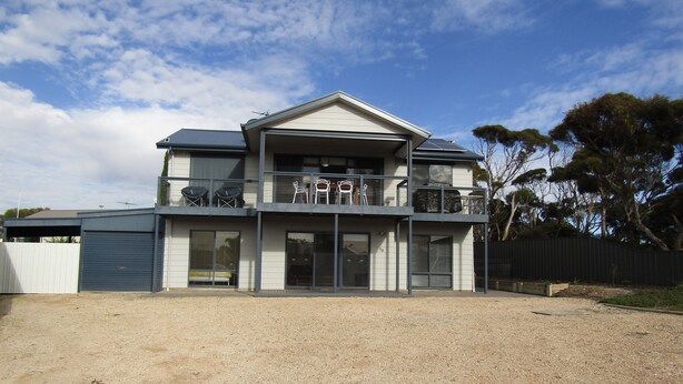 A two-story house with a balcony, large windows, and a garage. - Lady Doris,  wifi  - Off Peak Special! (Port Vincent)