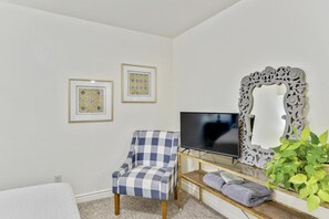 Queen bedroom with a TV and accent chair - Stay & Gather in Luxury! So close to Everything! (Orem)