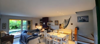 Cozy house with private garden in front of the sea