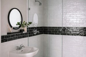 Designer toiletries, hair dryer, towels, soap