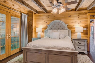 Log Cabin with living room fireplace and hot tub