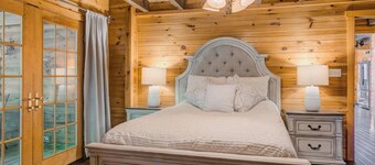 Log Cabin with living room fireplace and hot tub