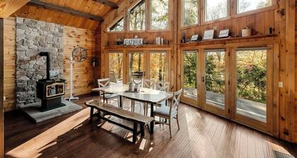 Log Cabin with living room fireplace and hot tub