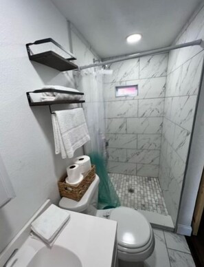 Shower, towels, soap, shampoo