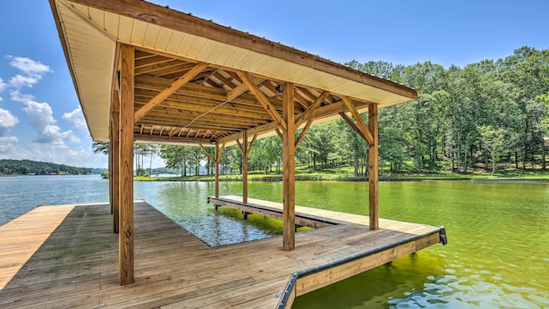 A wooden dock extending into a lake, with a covered pavilion structure. - ‘The Lake Escape’: Boat Dock, Fire Pit, Kayak! (Vincent)