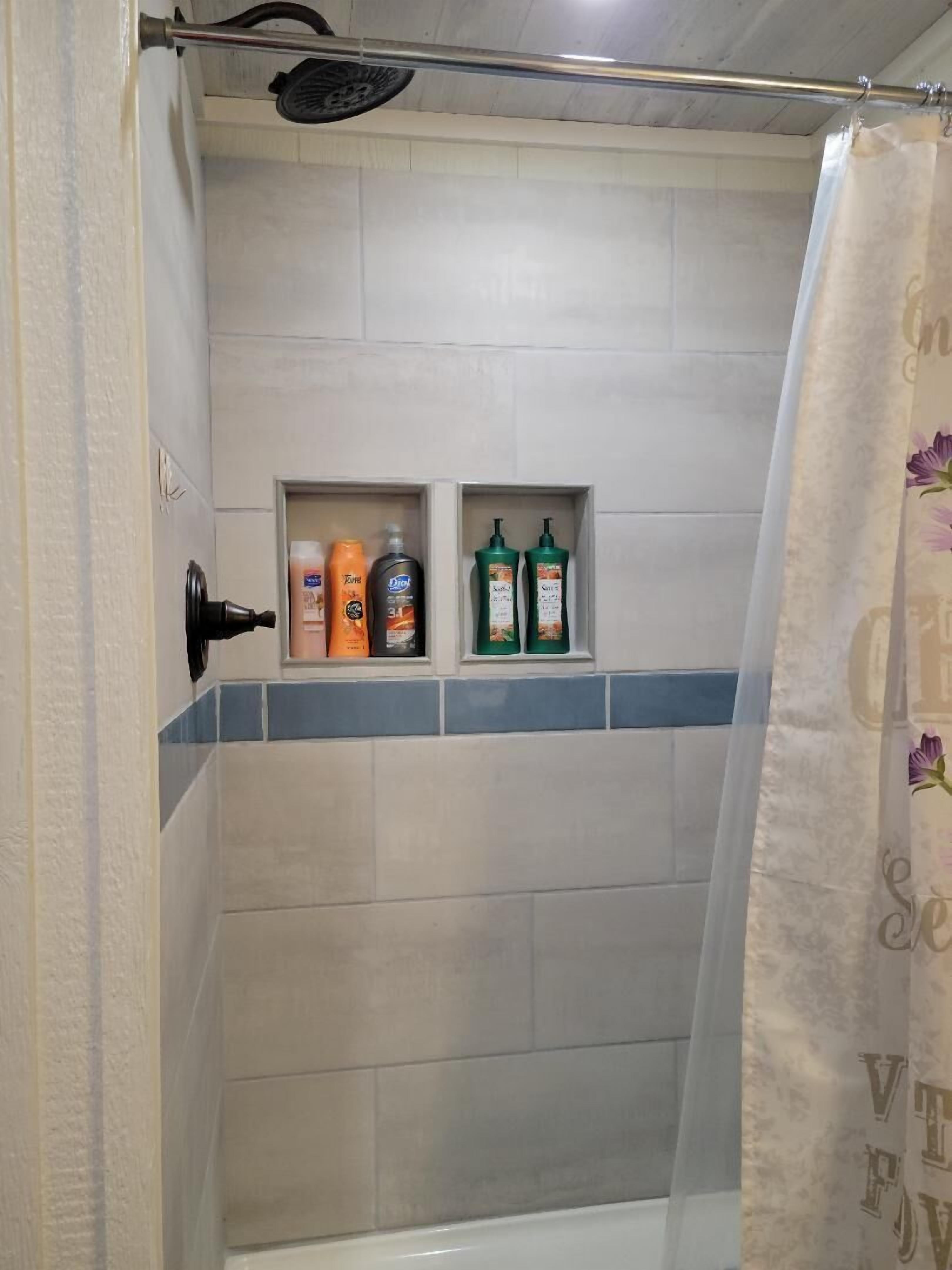 Combined shower/tub, hair dryer, towels, soap