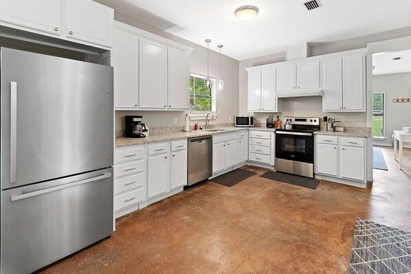 Fridge, coffee/tea maker, cookware/dishes/utensils