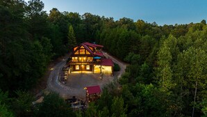 A lodge with a large central building and a smaller structure, surrounded by dense forest. - SKYVIEW STATION: Secluded 3-Lvl Log Cabin Views-Game-Theater (Cherokee County)