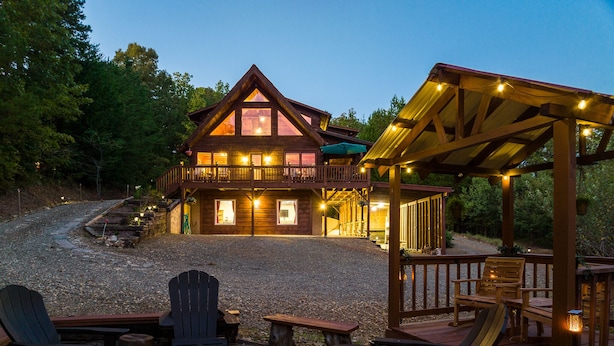 A lodge with a fire pit, outdoor seating, and a covered deck area. - SKYVIEW STATION: Secluded 3-Lvl Log Cabin Views-Game-Theater (Cherokee County)