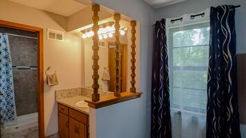 Bathtub, hair dryer, towels, soap