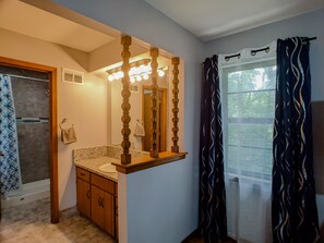 Bathtub, hair dryer, towels, soap