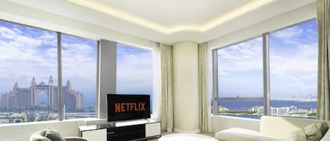Deluxe Apartment | Living area | 55-inch Smart TV with cable channels, TV, Netflix