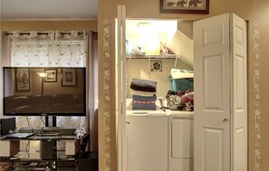 Enjoy a functional living space with a mounted TV and decorative panel door.