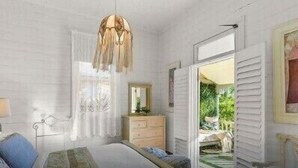 A bedroom with a bed, a dresser, a mirror, and a window with shutters. - Massinger Hideaway (Byron Shire)