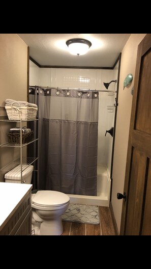 Shower, towels, soap, toilet paper
