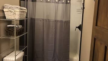 Shower, towels, soap, toilet paper