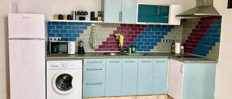 Fridge, microwave, stovetop, coffee/tea maker