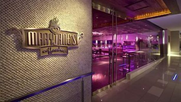 A restaurant with a sign that reads 'MARTIN'S' and a modern interior with glass partitions. - Hard Rock Hotel SAN Diego (SAN DIEGO)