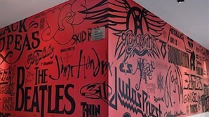 A building facade covered with various graffiti and text, including 'The Beatles' and 'Skid R.' - Hard Rock Hotel SAN Diego (SAN DIEGO)