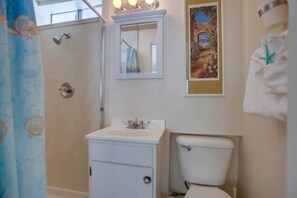 Shower, hair dryer, towels, shampoo