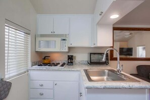 Fridge, microwave, stovetop, coffee/tea maker