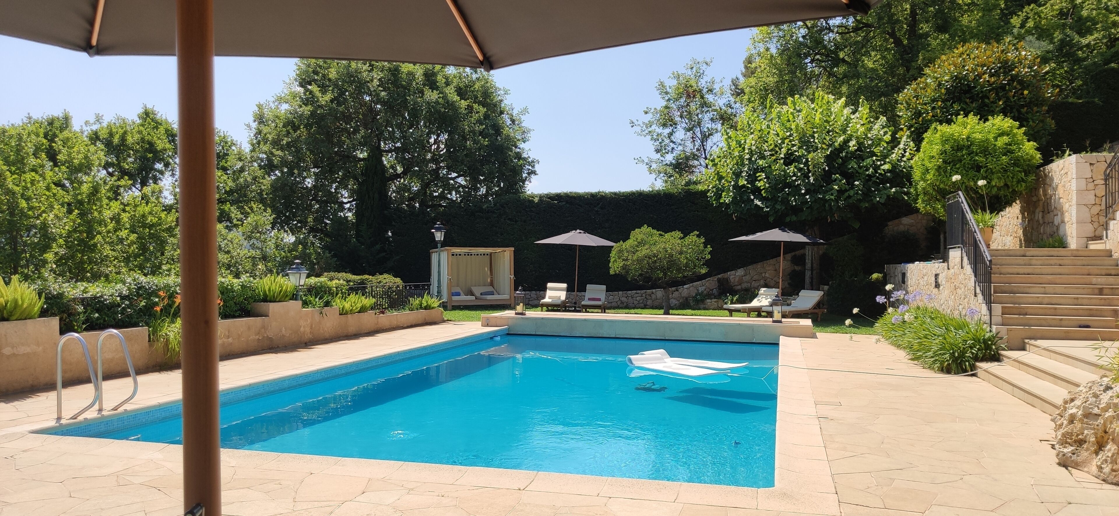 Seasonal outdoor pool, open 9:00 AM to 8:00 PM, pool umbrellas