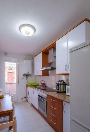 Fridge, oven, electric kettle, toaster