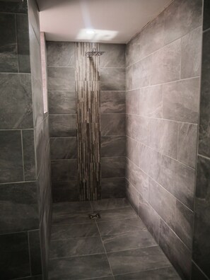 Shower, rainfall showerhead, hair dryer, towels