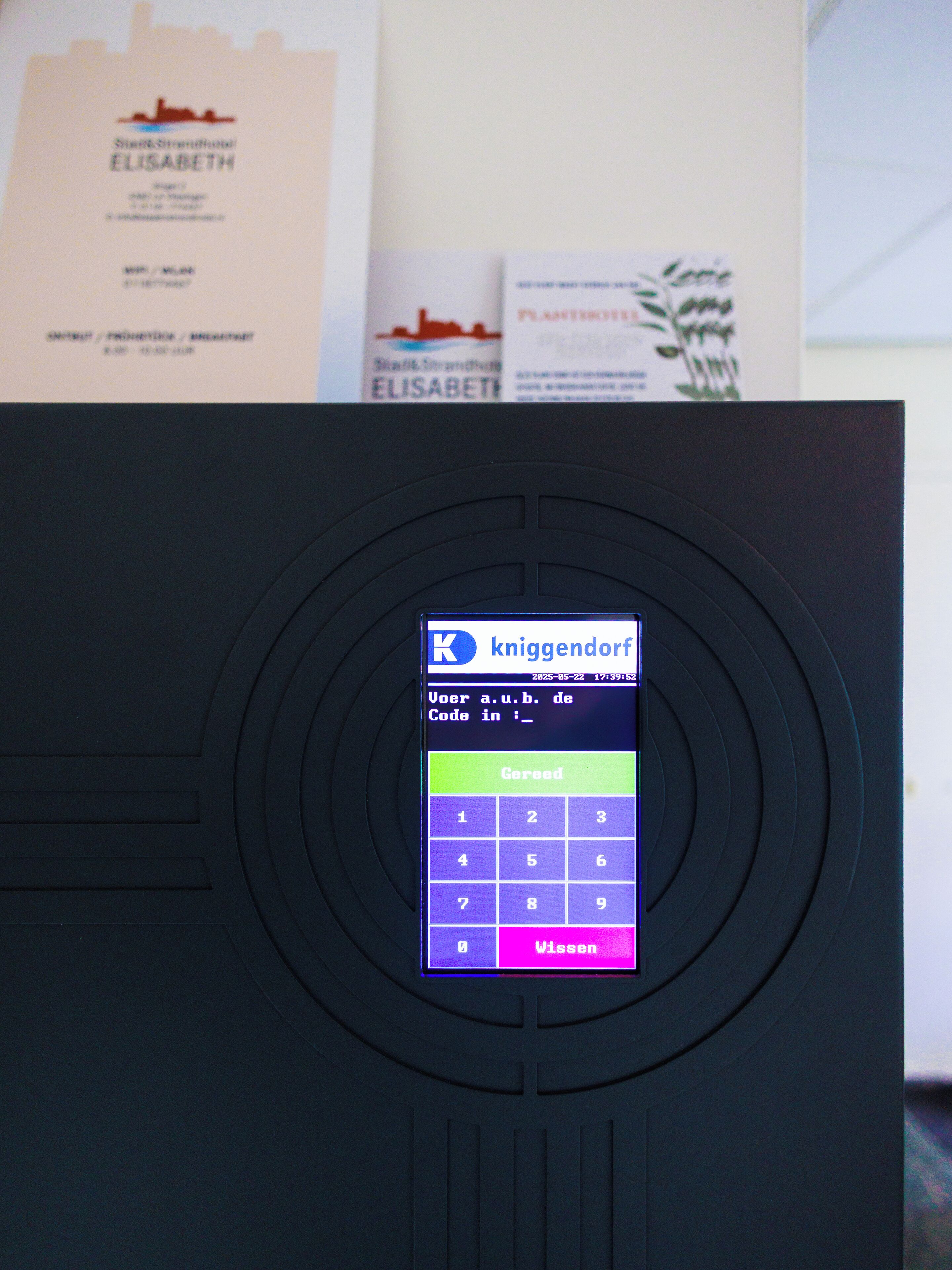 A keypad with a digital display and a keypad layout for entering a code.