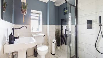 Bathtub, hair dryer, towels, soap