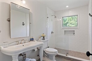 Shower, hair dryer, towels, toilet paper