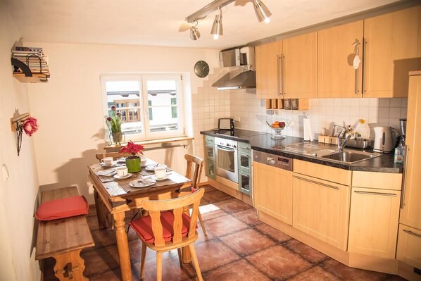 Fridge, stovetop, dishwasher, coffee/tea maker