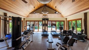 A gym with treadmills, stationary bikes, and weight machines. - Mauna Lani Villages luxurious Villa with Private Beach Access! (Waimea)