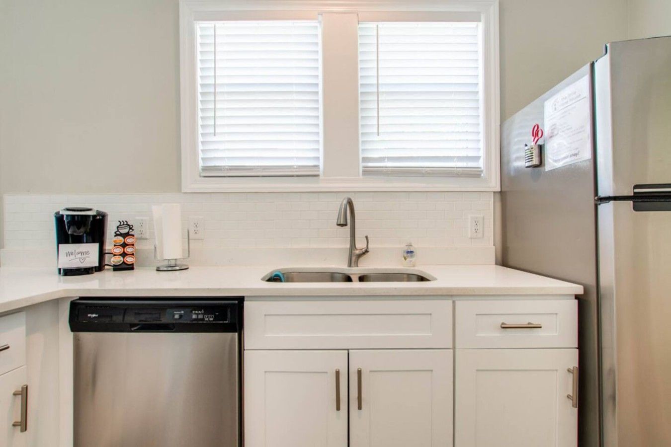 Coffee & Clean-Up Made EasyStart your day with a fresh brew from the Keurig and enjoy the convenience of a dishwasher and full-size fridge — all in a bright, modern kitchen setup.