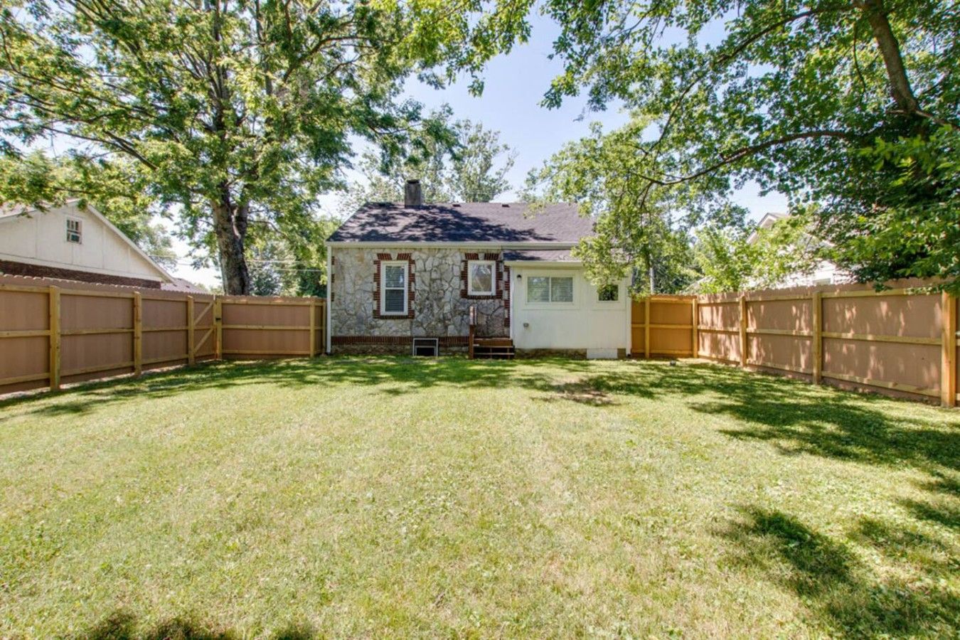 Fenced backyard – great for pups
