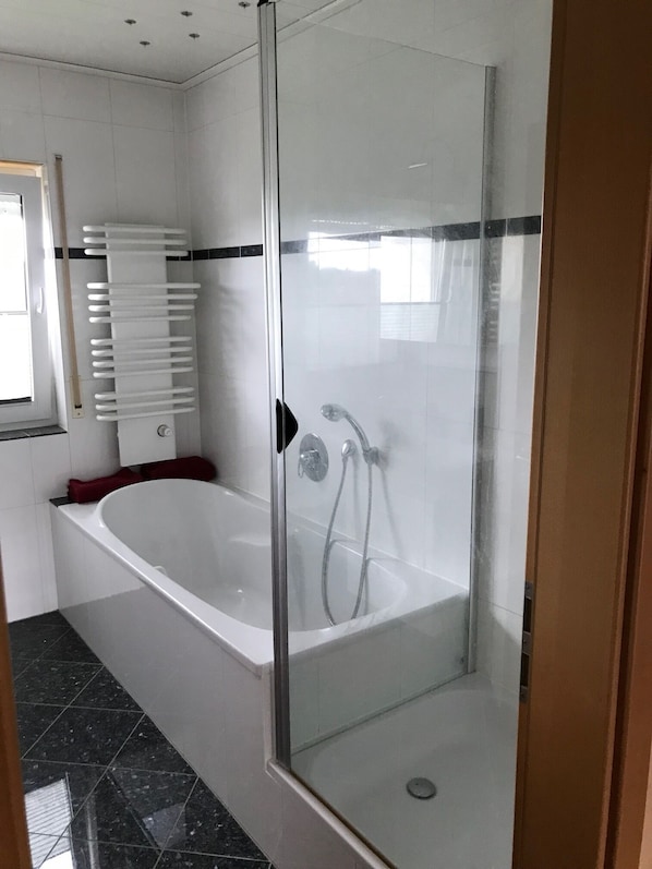 Bathtub, hair dryer, towels, soap