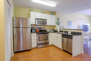 Microwave, dishwasher, coffee/tea maker, cookware/dishes/utensils