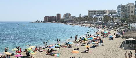 On the beach, sun loungers, beach towels