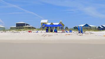 On the beach, sun-loungers