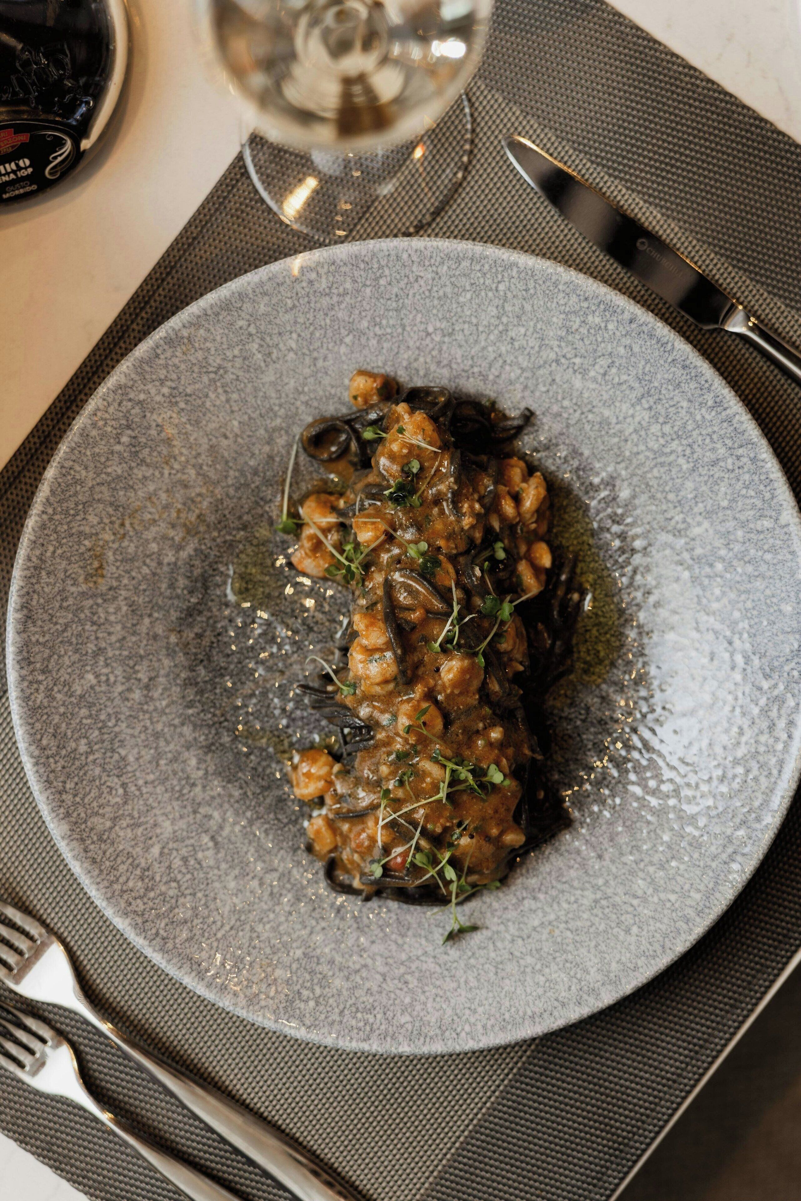 A plate of food on a textured mat.